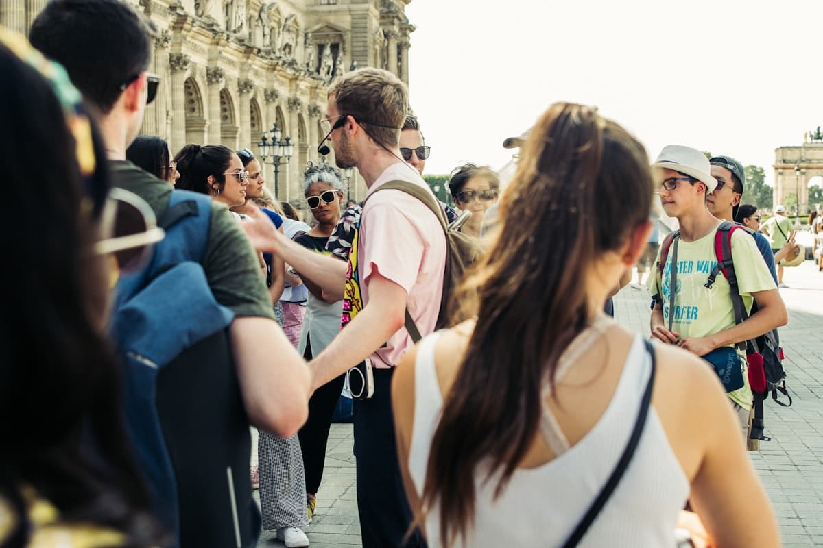 Tour guide leading a walking group through a London street